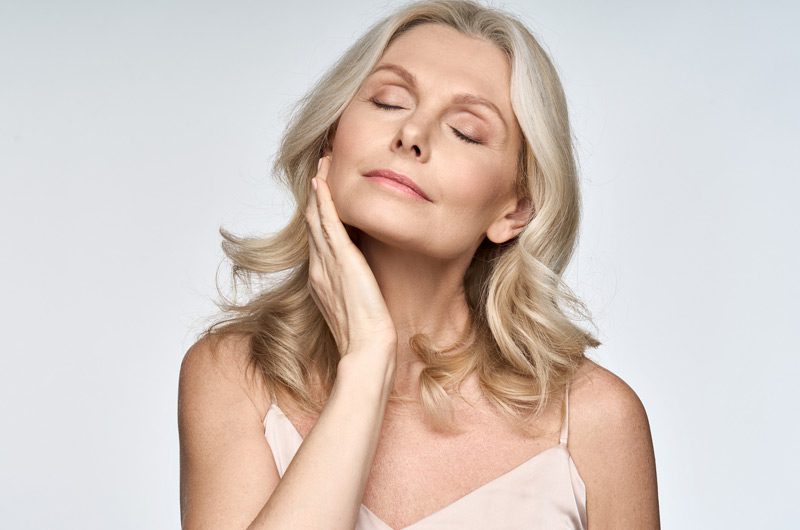 Older-woman-enjoying-clear-skin-after-receiving-photofractional-laser-treatment-in-Ladera-Ranch